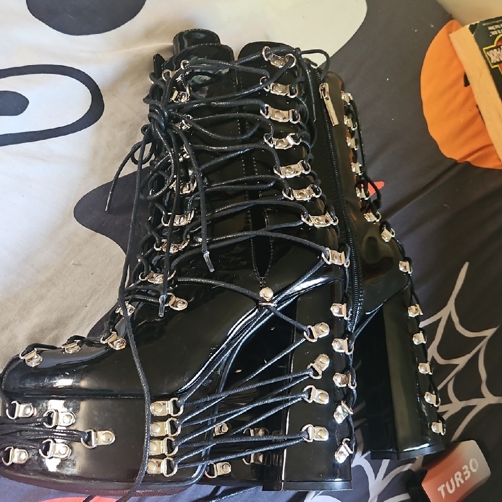 Glossy Black Lace-Up Boots with Silver Accents